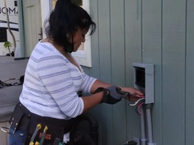 Licensed electrician wiring an exterior subpanel in Wildwood Lake
