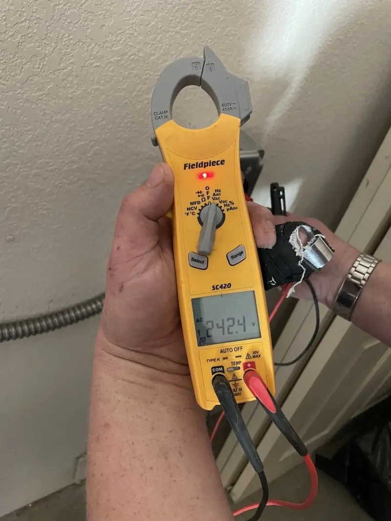 Voltage testing with clamp meter during Aluminum Wiring Replacement in Wildwood Lake